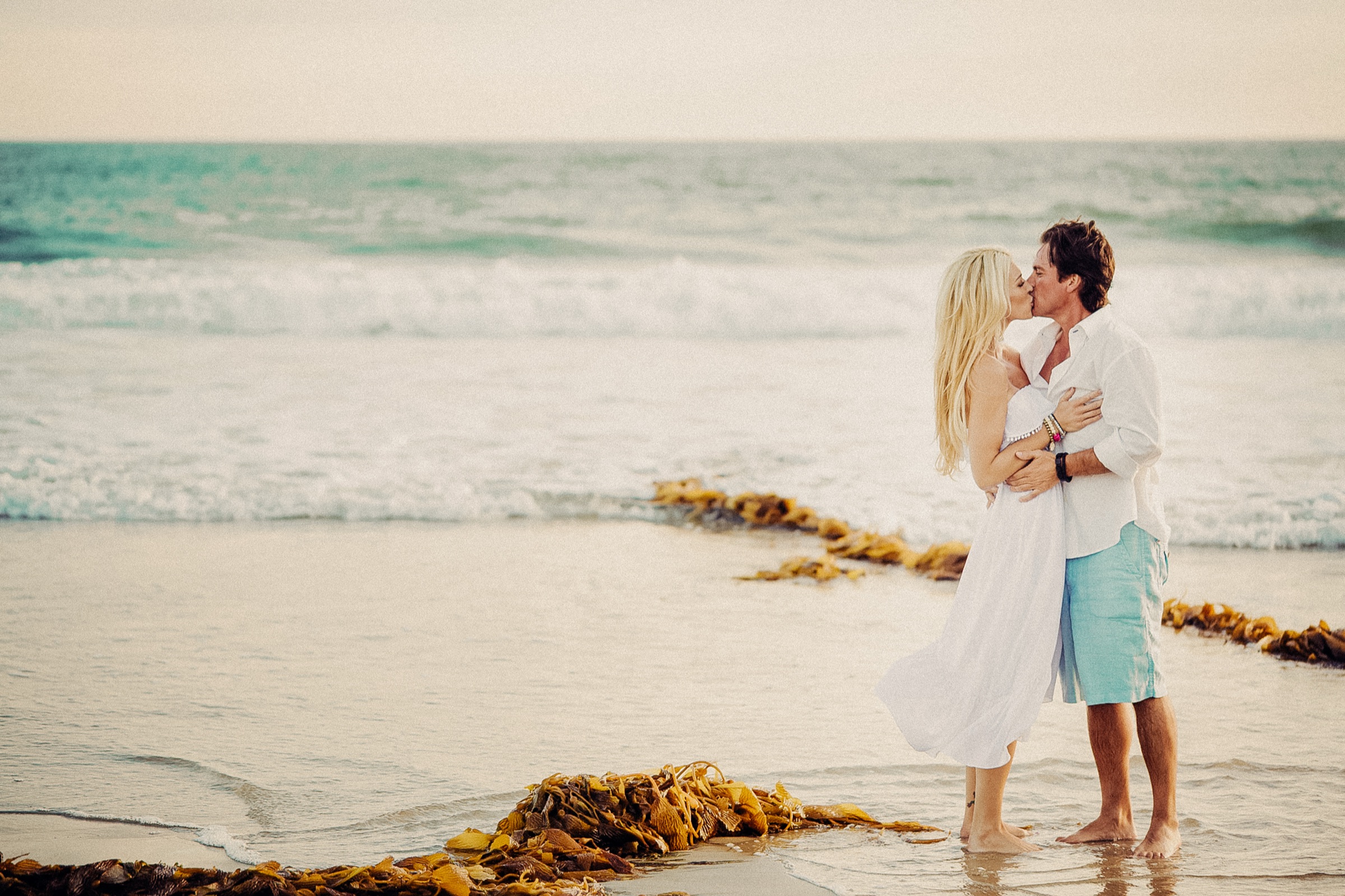 Destination wedding couple photographed in a wide scenic landscape