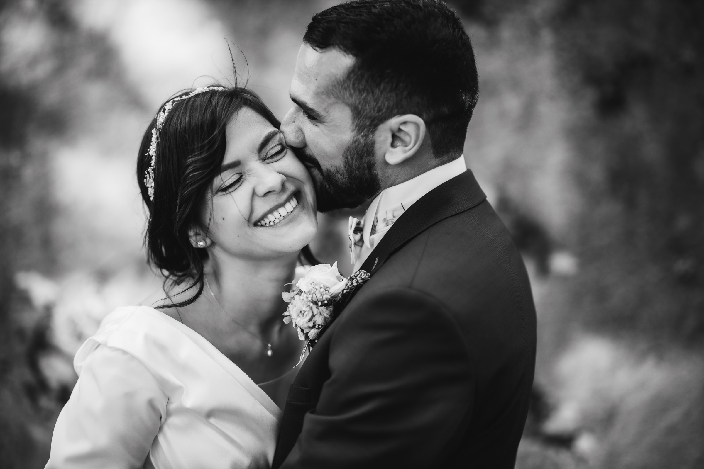 Black and white portrait of a couple laughing together
