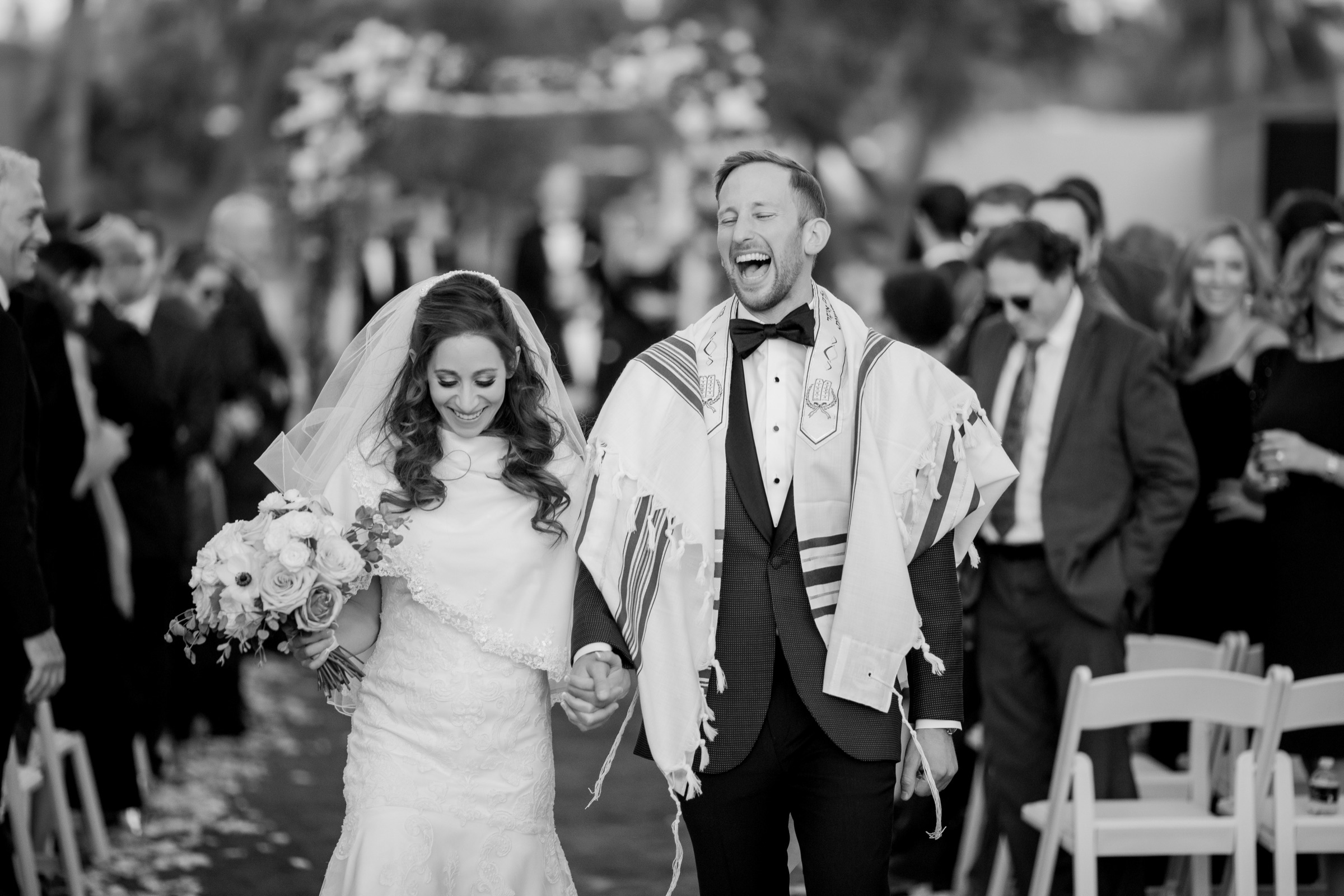 Jewish couple smiling together in black and white