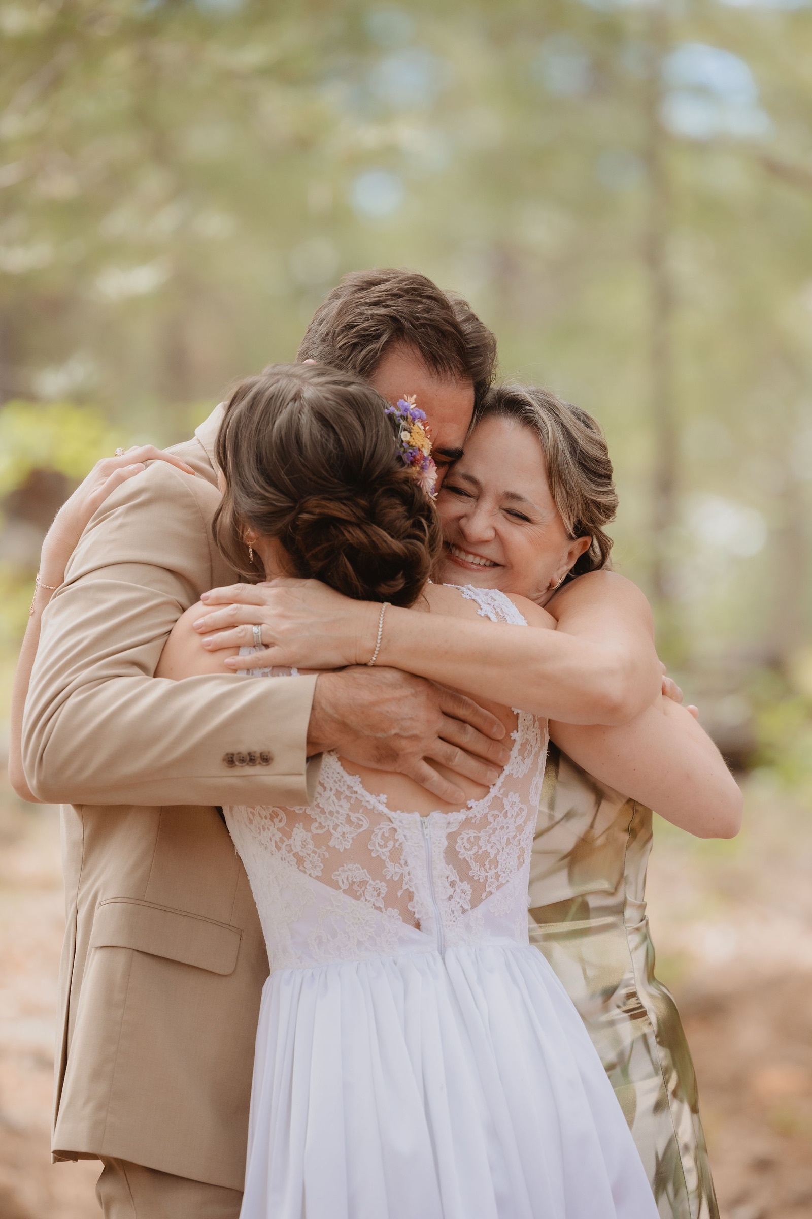 Kellie hugging family during the parent first look