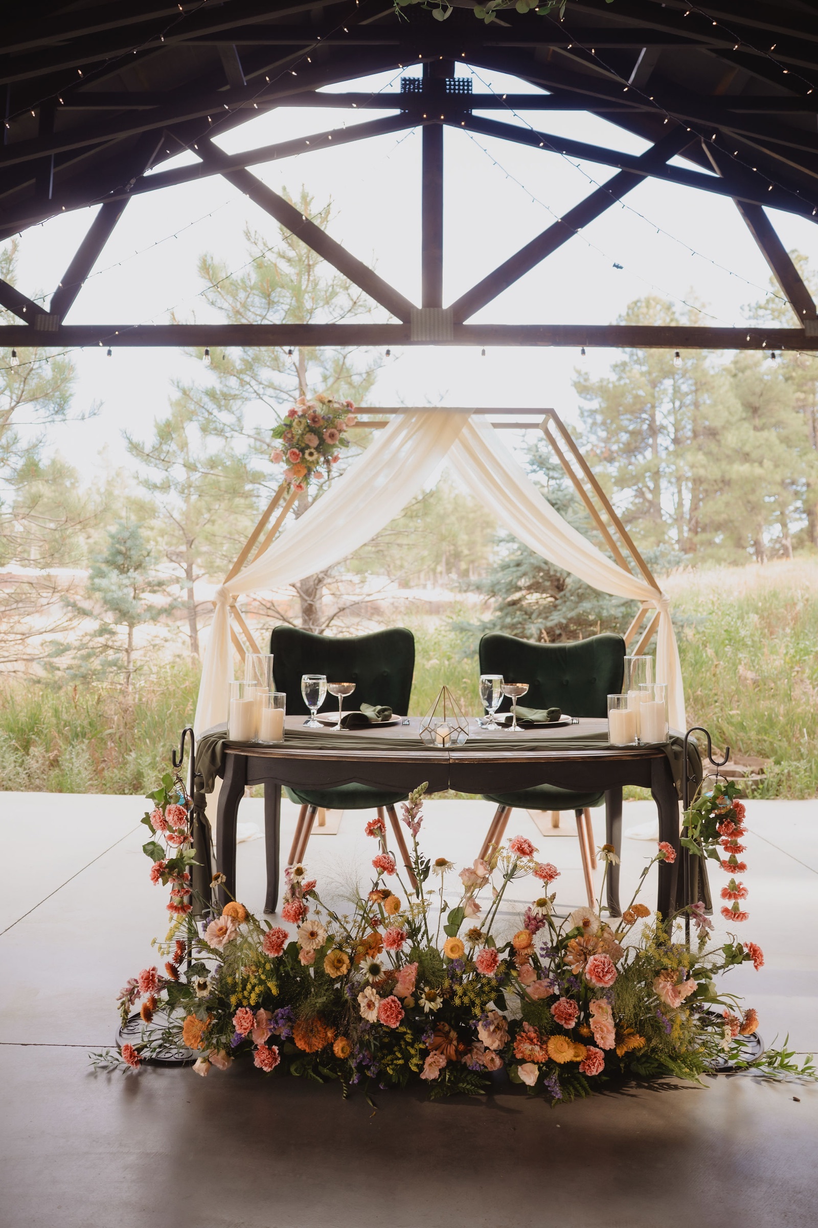 Ceremony frame and piano setup at Aldea in the Woods