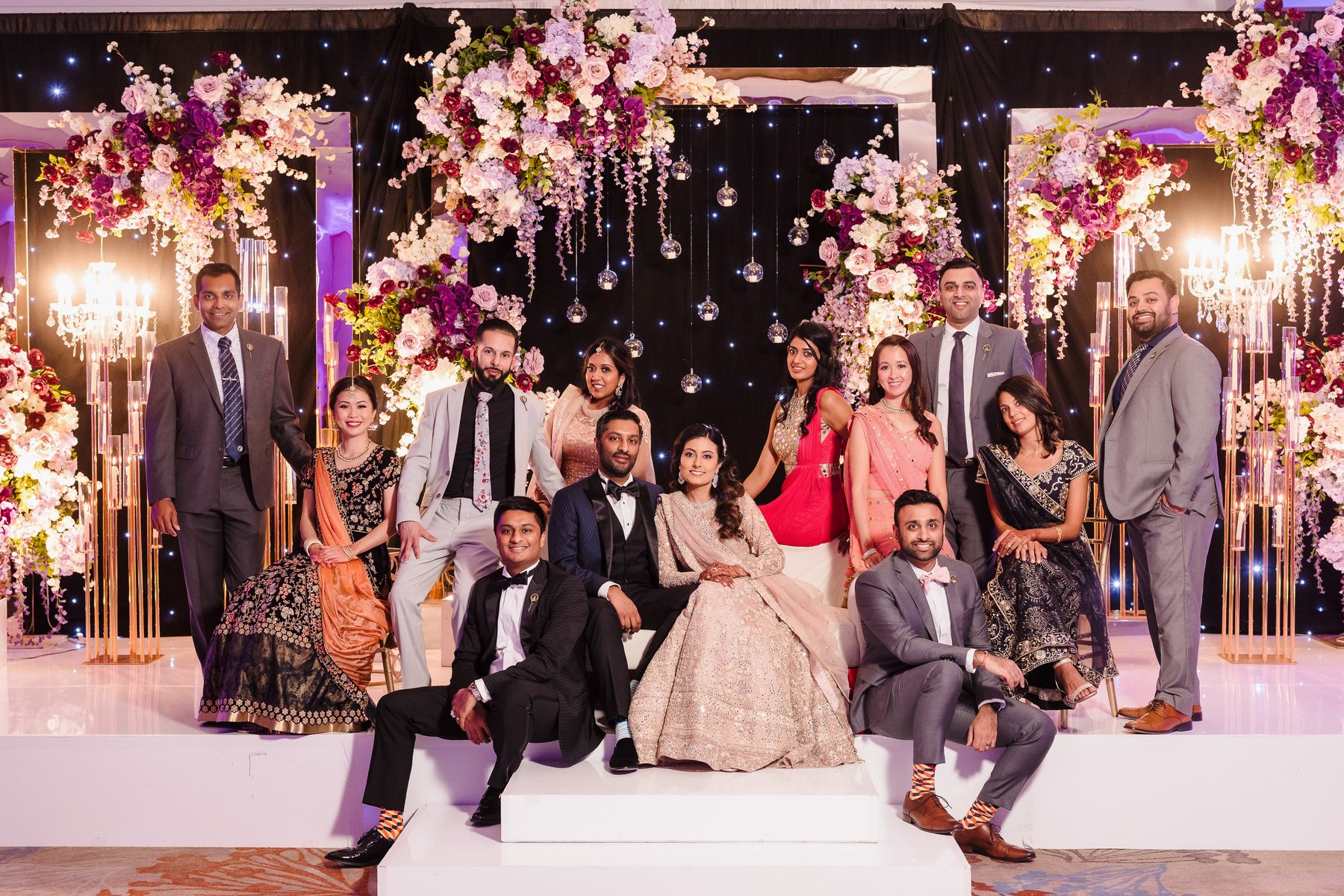 South Asian wedding celebration on a decorated stage