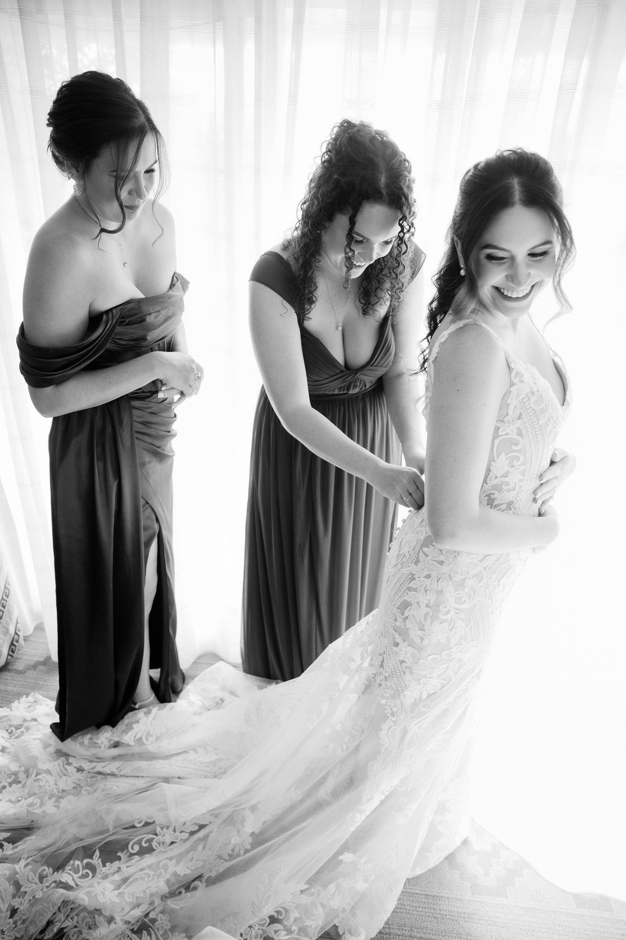 Brittney getting into her wedding dress