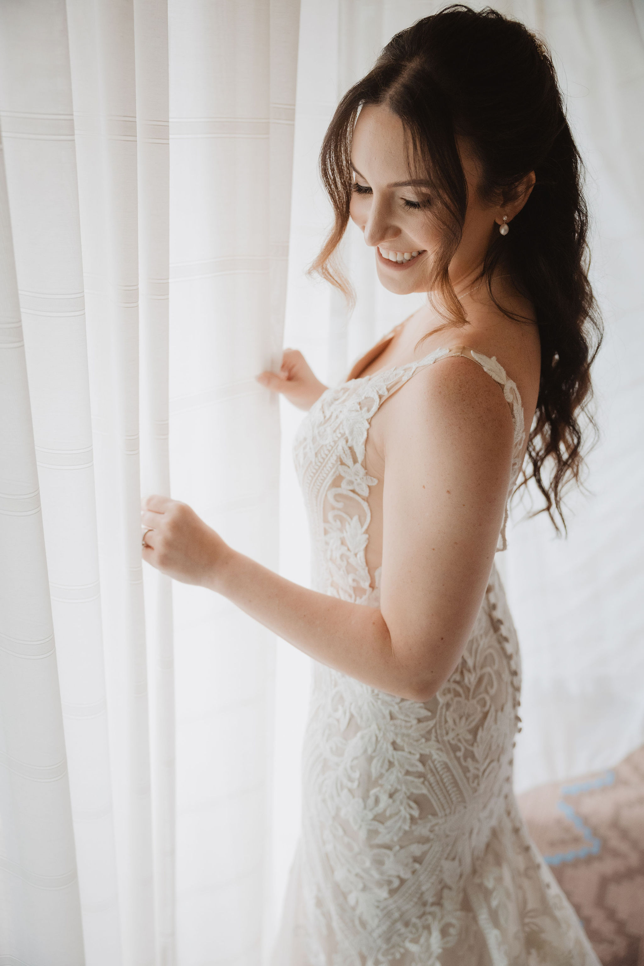 Brittney getting ready near the window