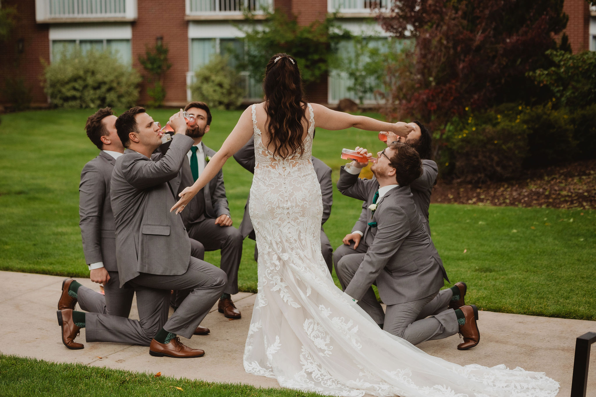 Groomsmen joking with Brittney before the ceremony