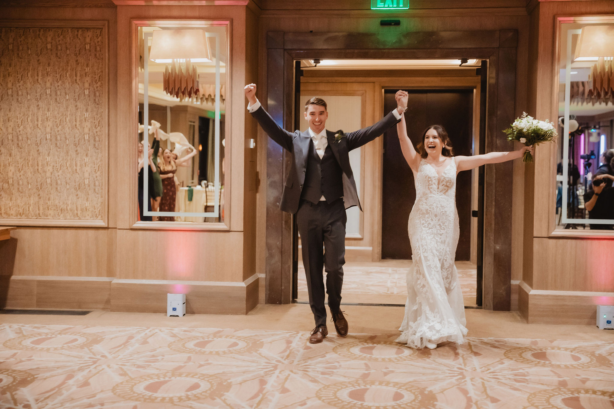 Brittney and Trevor entering the reception at Little America Hotel