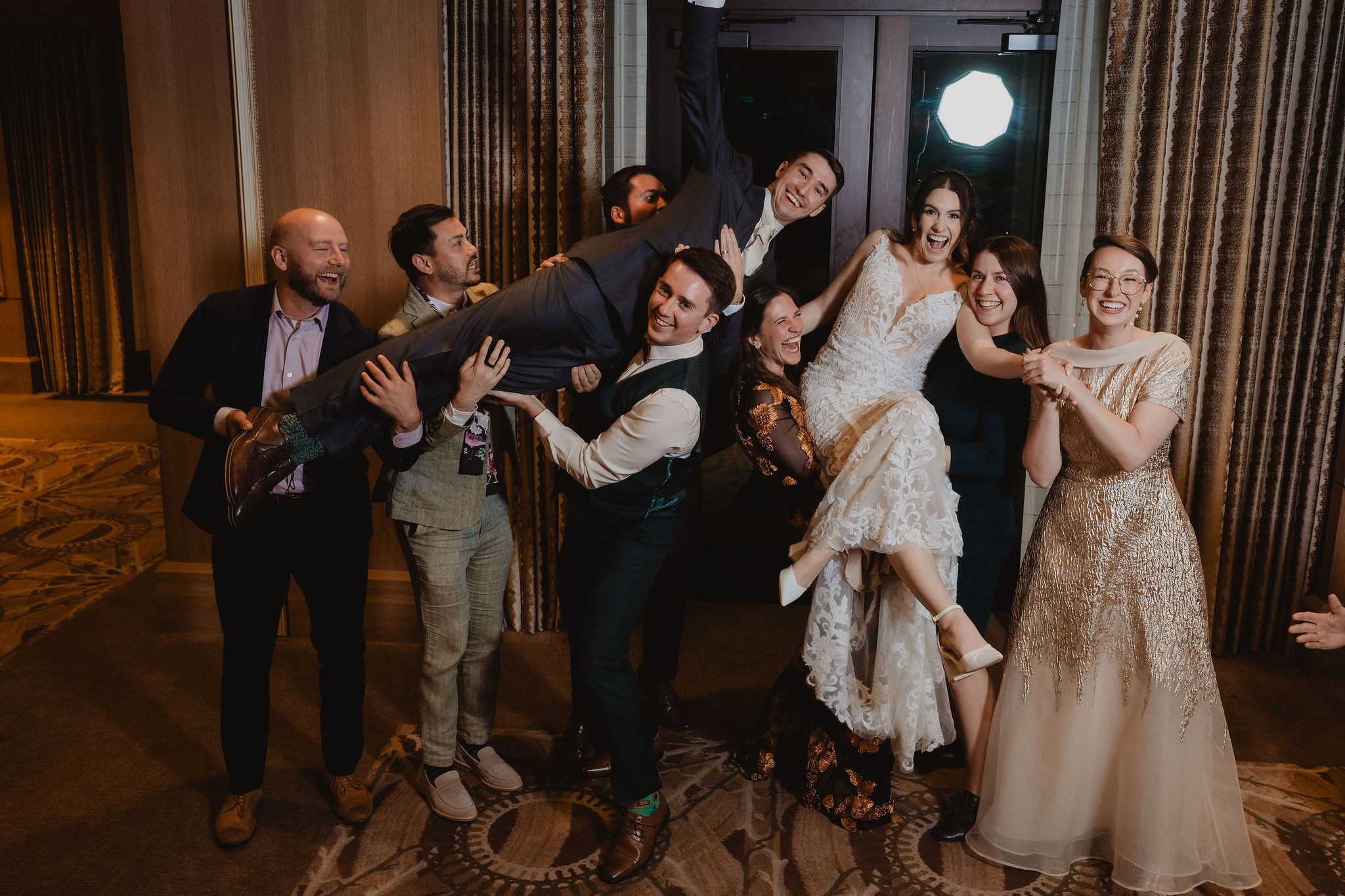 Guests making a playful pose with Brittney and Trevor