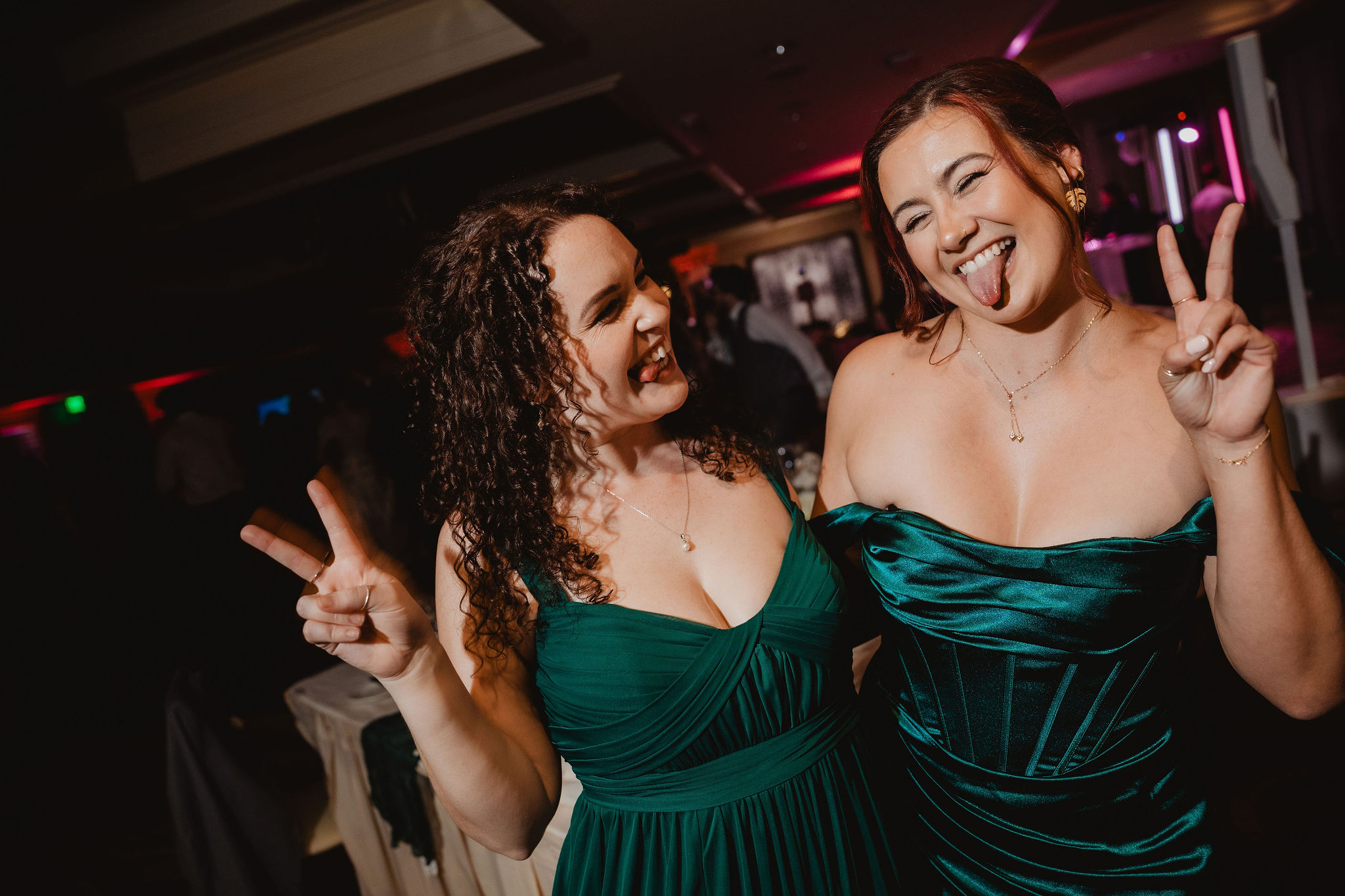 Bridesmaids laughing on the dance floor
