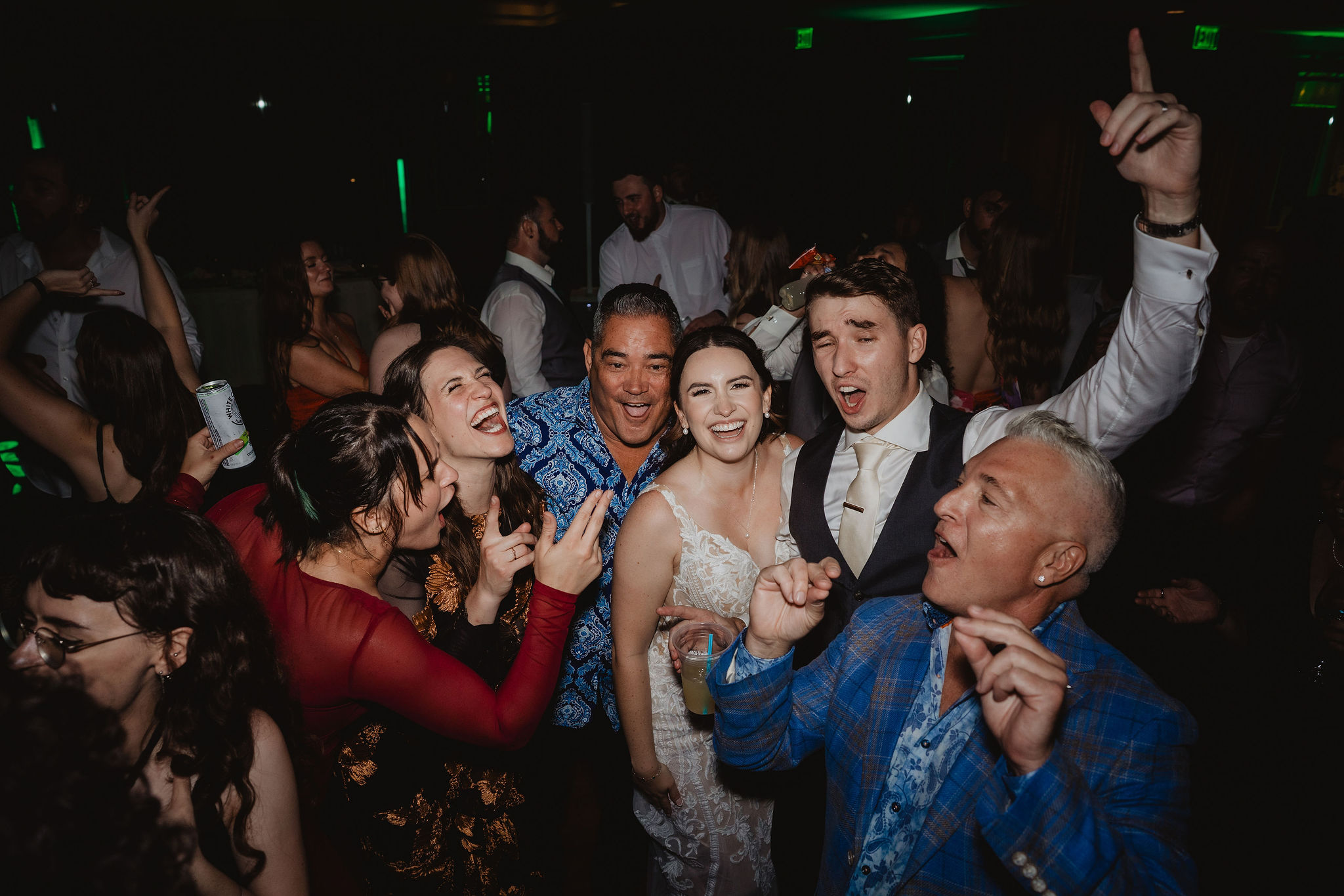 Brittney and Trevor surrounded by guests on the dance floor
