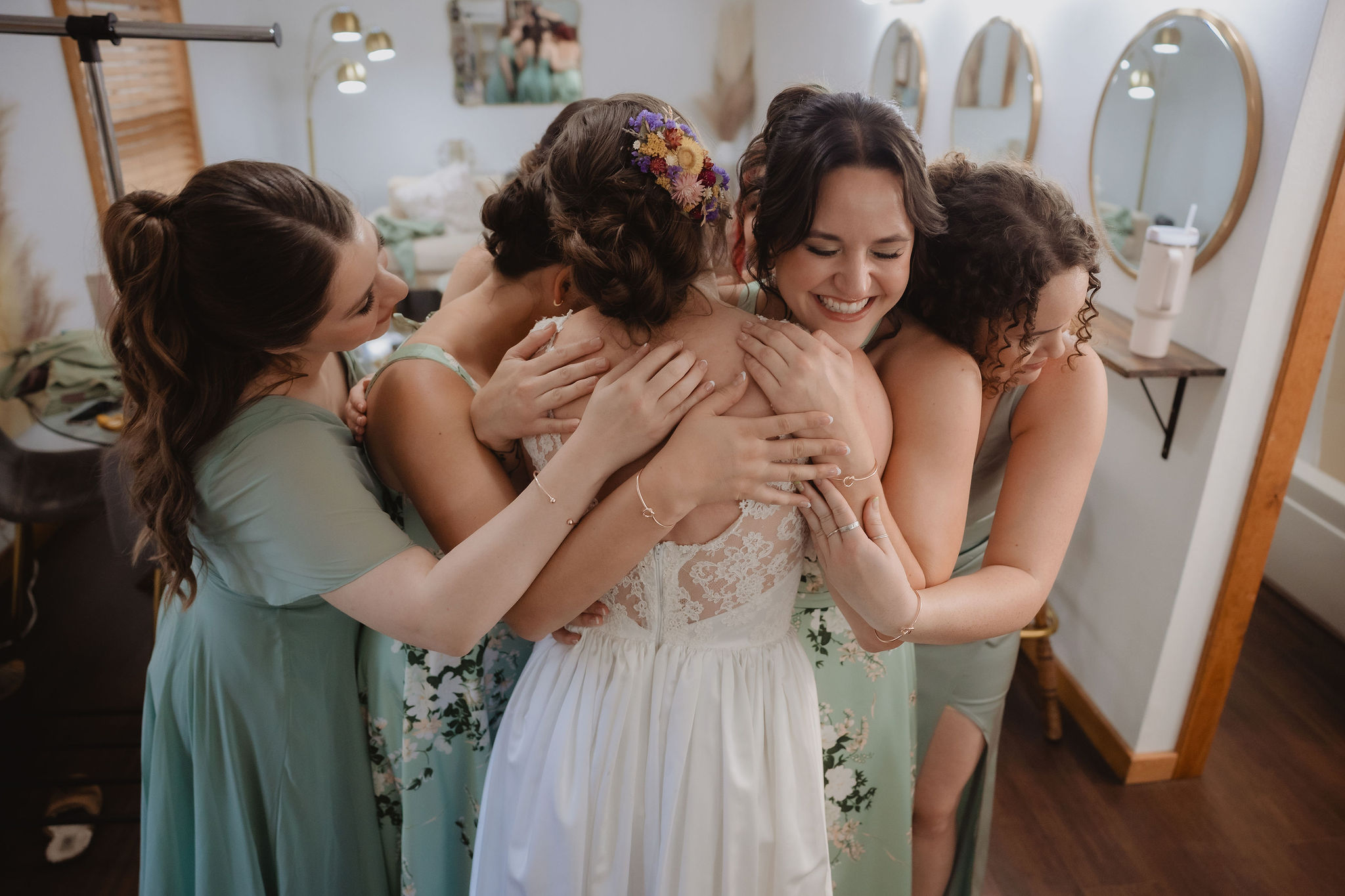 Kellie getting into her wedding dress with bridesmaids