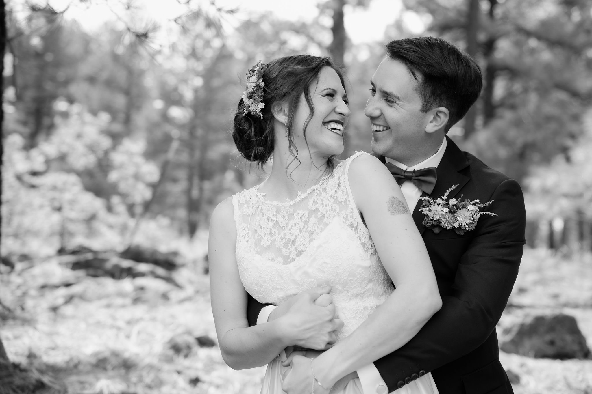 Black and white portrait of Kellie and Jake laughing together