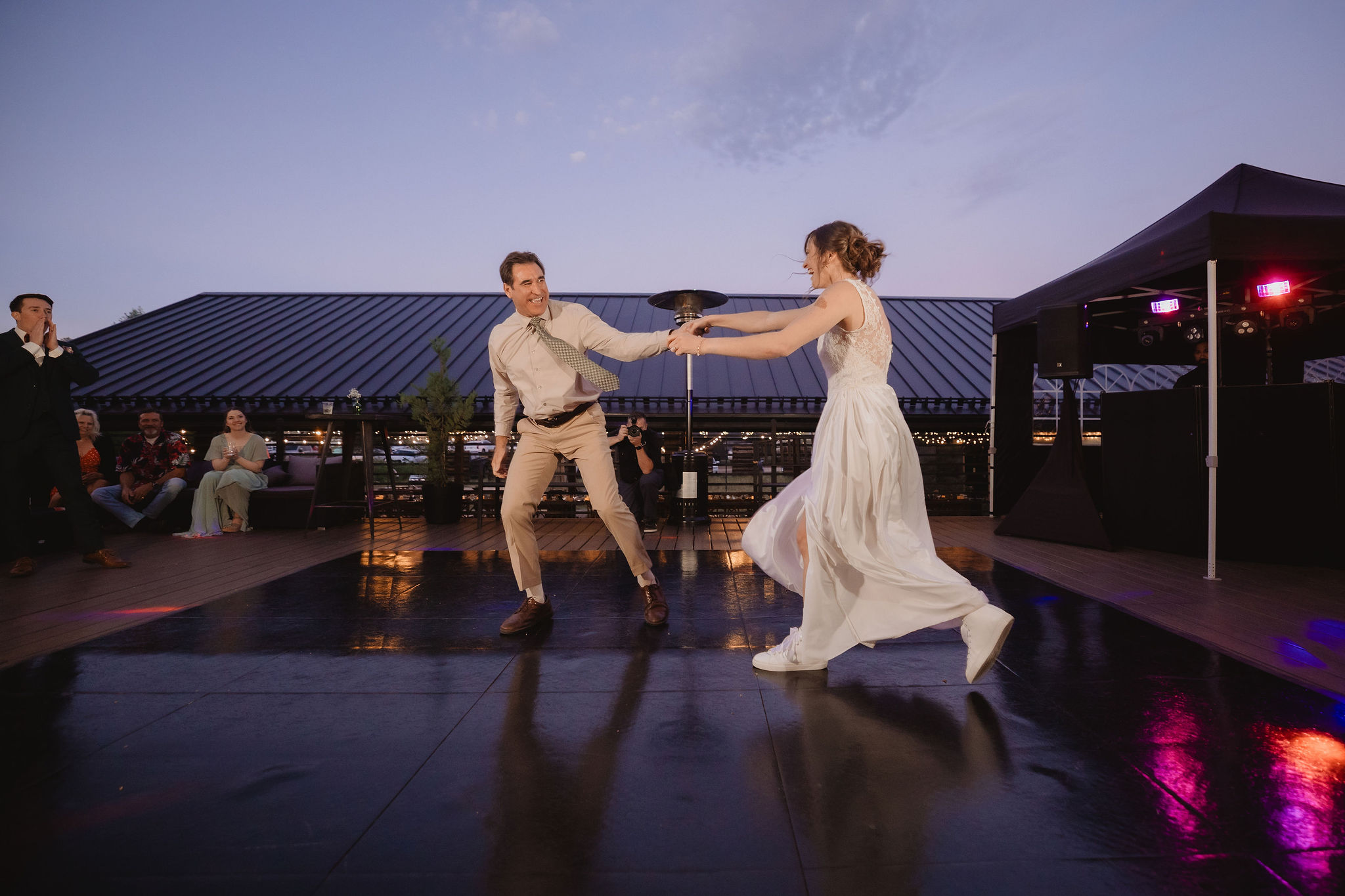 Kellie and her dad starting their energetic choreographed dance