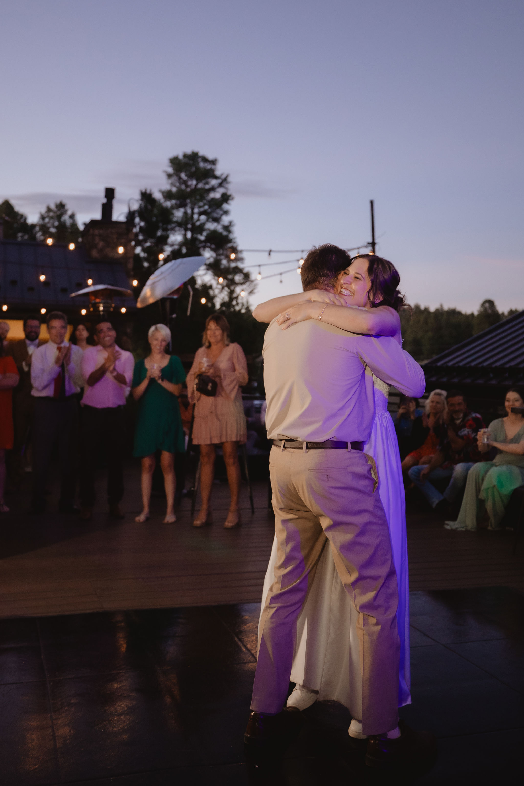 Kellie and Jake sharing a dance at dusk