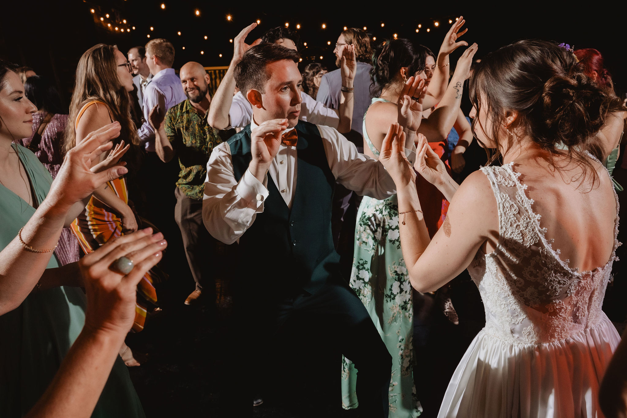 Kellie and Jake laughing with guests during the reception