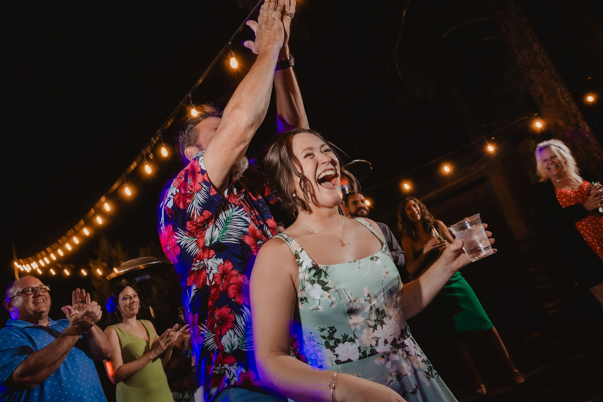 Guest celebrating on the dance floor at night