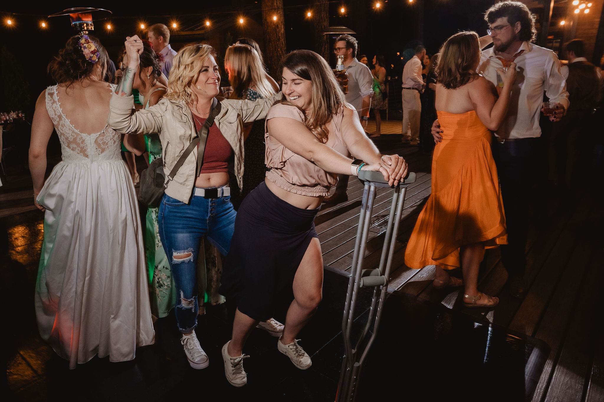 Kellie and Jake surrounded by dancing guests